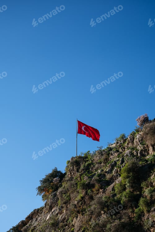 Preview: Turkish Flag Over Rocky Cliff