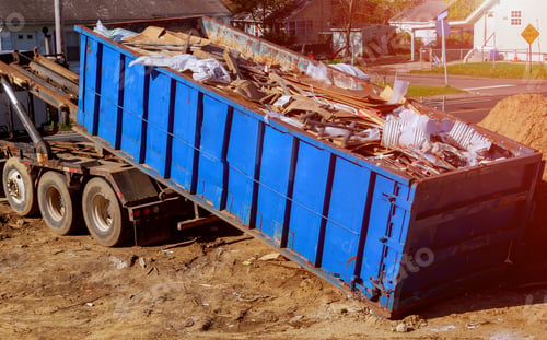 Preview: Industrial garbage bin blue construction debris container filled with rock and concrete rubble.