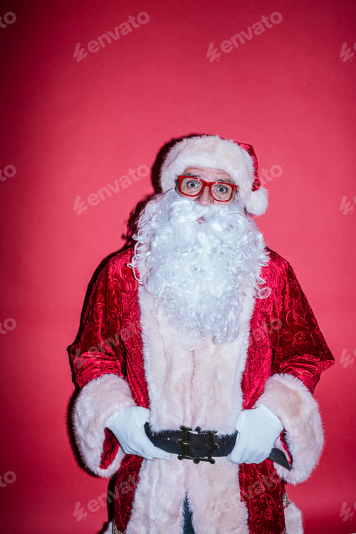 Preview: Man dressed as Santa Claus gesturing with funny glasses