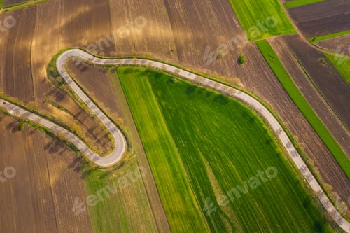 Preview: agricultural hills in spring. Seasonal work concept image.