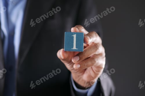 Preview: men holding number one close up