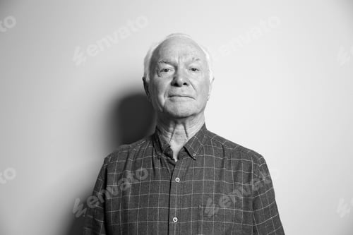 Preview: Portrait of elderly man on light background. Black and white effect