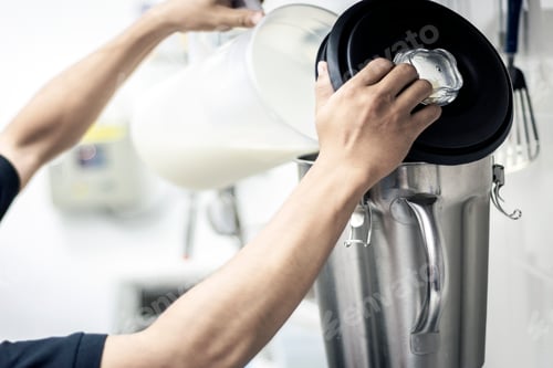 Preview: making gelato ice cream with modern equipment in kitchen interior
