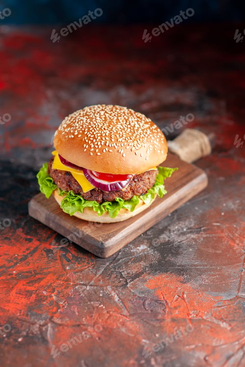Preview: front view delicious meat cheeseburger on dark brown background fast-food meal dinner dish snack
