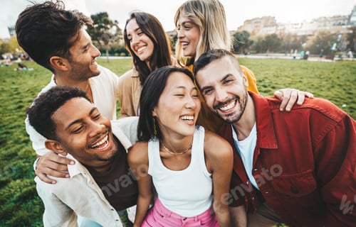 Preview: Multiracial young people laughing together outside