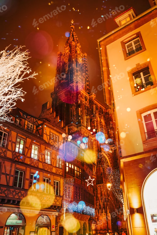 Preview: STRASBOURG, FRANCE - December 2020 - Cathedral Notre Dame with Christmas illuminations