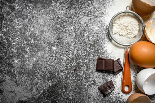 Preview: Baking background. Ingredients for biscuits on a rustic background.