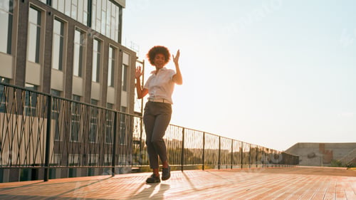 Preview: Female silhouette in sunshine city urban active playful happy girl African American business woman
