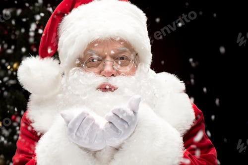 Preview: Santa Claus blowing snowflakes from hands
