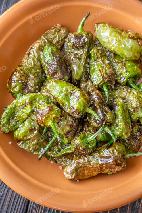Preview: Terracotta bowl of Pimientos de Padron sprinkled with coarse sea salt