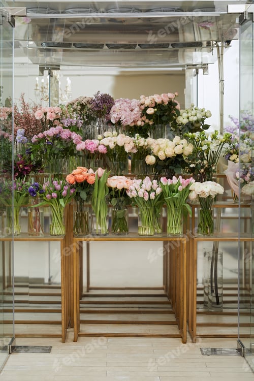 Preview: roses, tulips and peonies in vases on glass tables