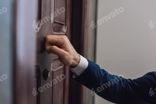 Preview: Cropped view of collector knocking on door with hand