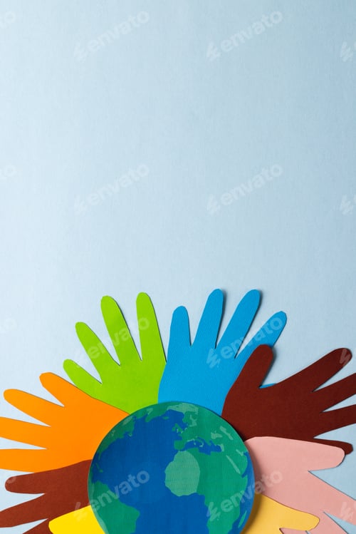 Preview: Paper cut out of multi coloured hands and globe with copy space on blue background