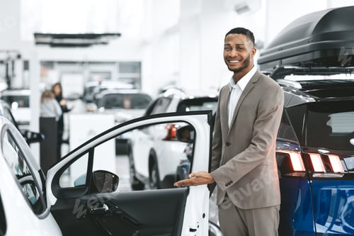 Preview: Dealer Showing New Automobile Opening Door Standing In Dealership Center
