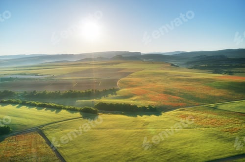 Preview: Aerial fields and meadow in mountain.