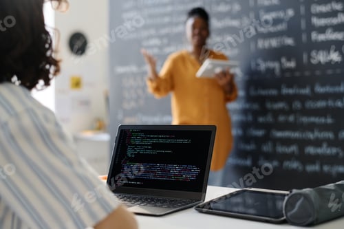Preview: Student typing codes on computer