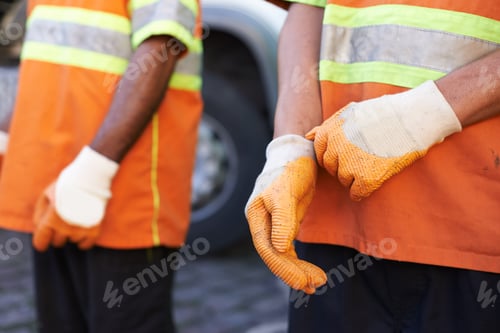 Preview: Keeping the city clean. Cropped shot of a team of garbage collectors.