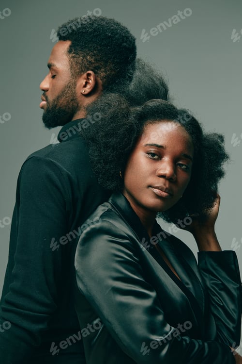 Preview: Two stylish models exuding confidence, showcasing natural hair, with contrasting black attire