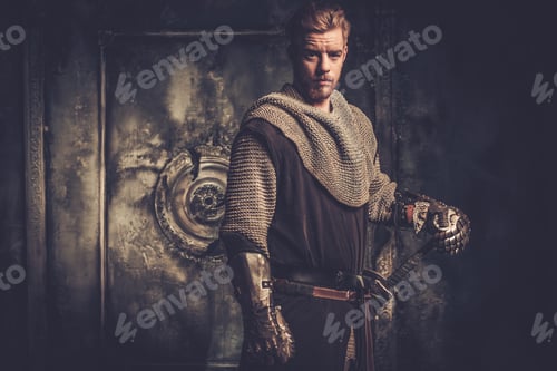 Preview: Young medieval knight standing on dark background.