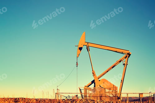 Preview: Vintage color toned an old oil pump oil business concept.