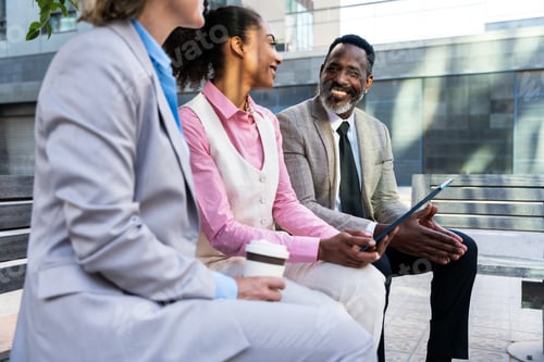 Preview: Group of multiethnic business people meeting outdoors