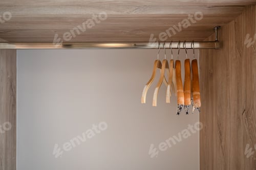 Preview: Empty Wooden Closet with Hangers for Stock Photography