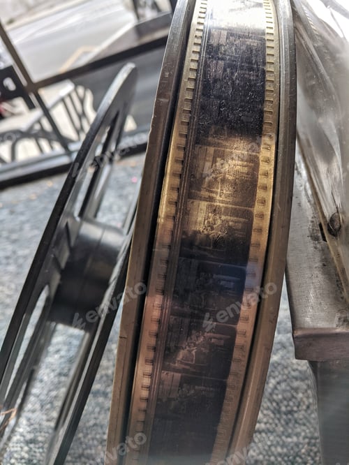 Preview: Close up old movie reel serie, vintage cinema film roll, retro still life