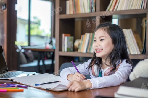 Preview: Student girl painting in the library at school. Education and learning concept.