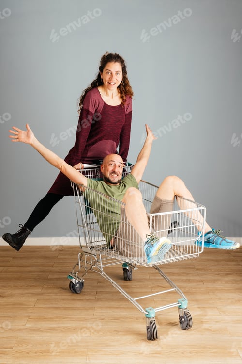 Preview: Man and Woman Playing With a Shopping Cart