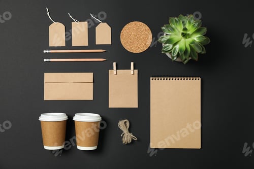 Preview: Flat lay composition with blank stationery and succulent on black background, copy space