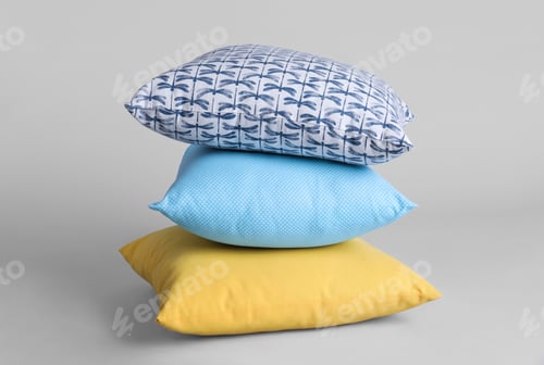 Preview: Stack of stylish soft pillows on grey background
