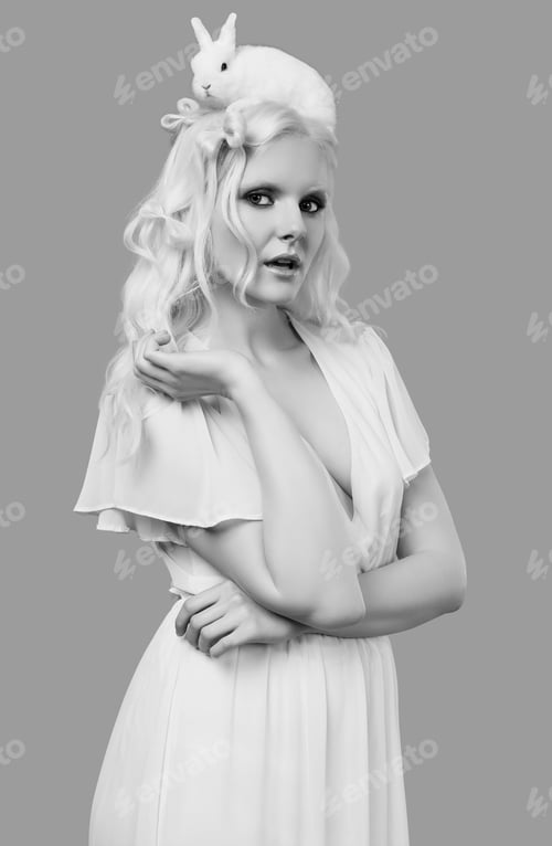 Preview: Fashion Portrait Of Albino Blond Girl With White Skin And Blue Eyes In Elegant Dress Posing With
