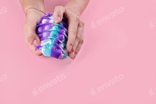Preview: Female hans using pastel color round popit toy antistress