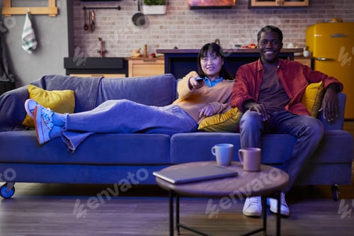 Couple Relaxing Together Watching Television at Home