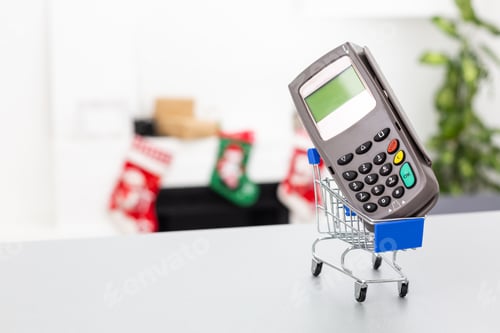 Preview: Top view photo of shopping trolley and cash register