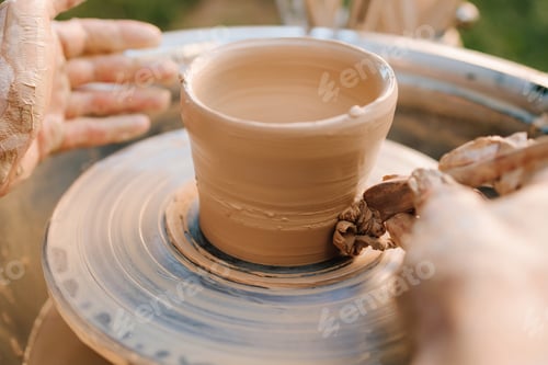 Preview: Close-up of Hands Shaping a Clay Pot on a Pottery Wheel