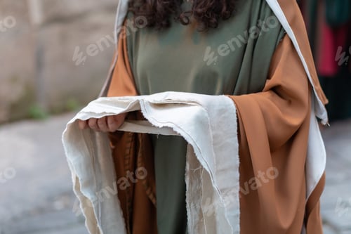 Preview: Woman Holding White Cloth for Wrapping Jesus Christ Body during Holy Week Procession
