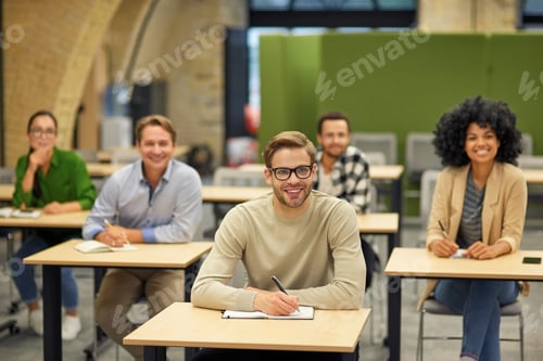 Preview: Business lecture. Group of happy multiracial people sitting in the modern office and listening to