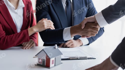 Preview: Happy couple first time home owners handshaking realtor insurer landlord bank worker at meeting