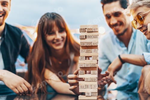 Preview: The company of young people playing jenga
