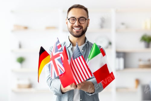 Preview: Modern education and student exchange. Cheerful young Caucasian guy holding bunch of different flags