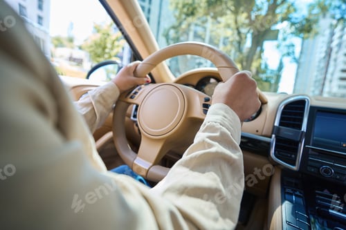 Preview: Woman driving a car on a city street