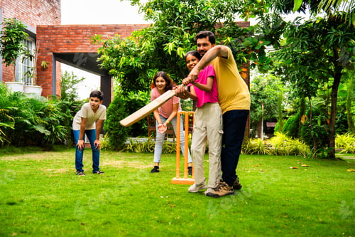 Preview: Indian Asian family bonding through outdoor cricket batting in garden, enjoying fun and play