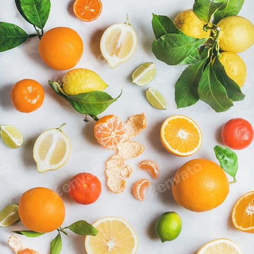 Preview: Variety of fresh citrus fruit over light grey marble background