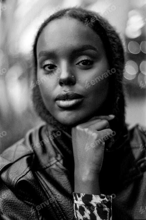 Preview: Young woman striking a thoughtful pose black and white