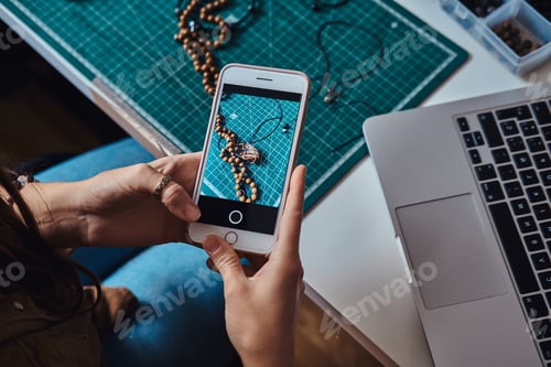 Preview: Girl is making a photo via mobile phone