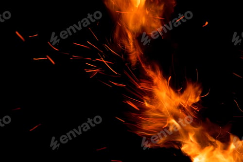 Preview: Closeup shot of fire flames glowing in the dark