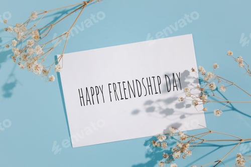 Preview: Happy friendship day words written on card.