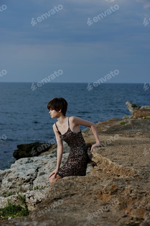 Preview: woman in dress in dress on nature rocks landscape outdoors