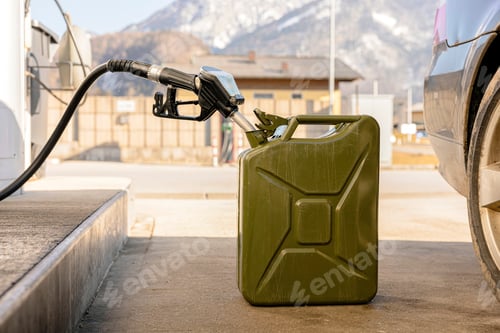 Preview: Refilling canister with fuel on the petrol station. Close up view. Fuel, gasoline, diesel